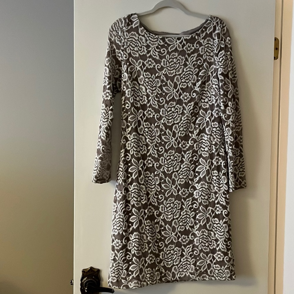 Beautiful lace overlay dress with long sleeves in lace. Does run a little small